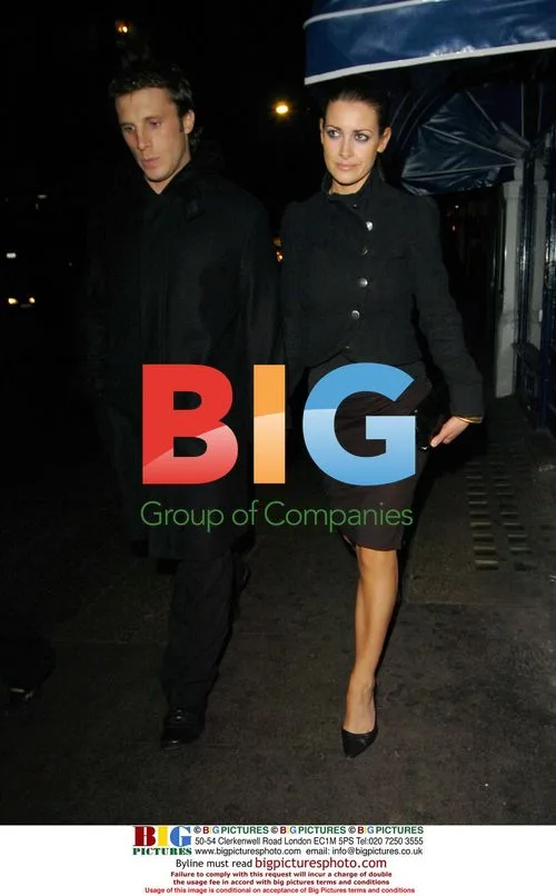 Presenter Kirsty Gallagher and partner arrive at the Ivy