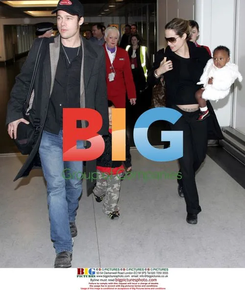 Angelina Jolie and Brad Pitt arrive at Heathrow