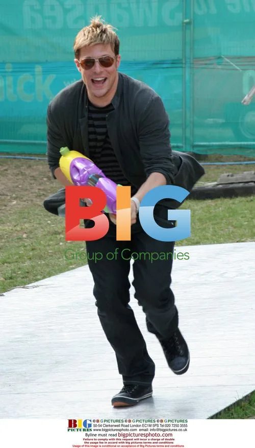 Duncan James soaked by water gun