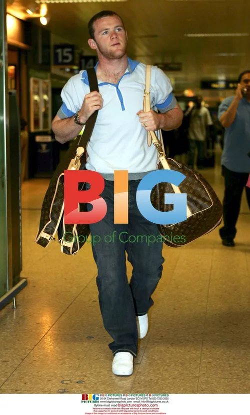 Wayne Rooney and Coleen arrive in London