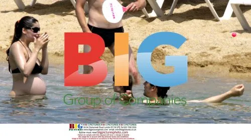 Laeticia Casta and Stefano Accorsi on Corsica beach