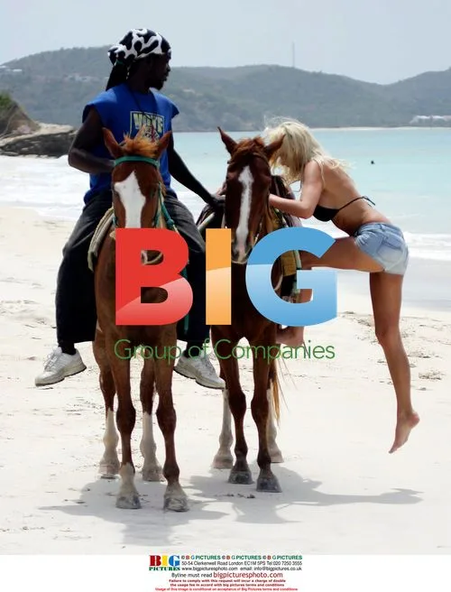 Emma B and boyfriend ride horses on Caribbean beach