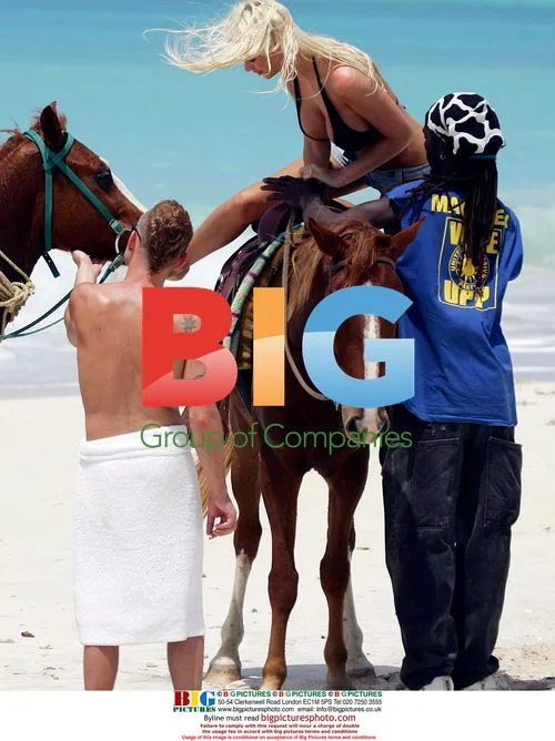 Model Emma B and boyfriend on beach horse ride