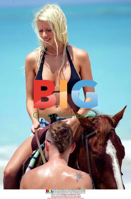 Model Emma B and boyfriend Bryan Harvey on beach horseback ride
