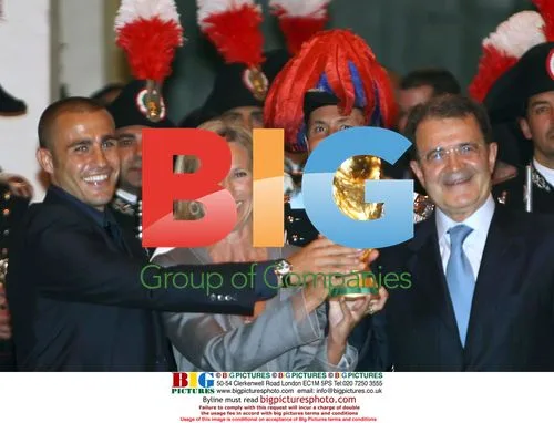 Cannavaro holds World Cup trophy with Italian officials