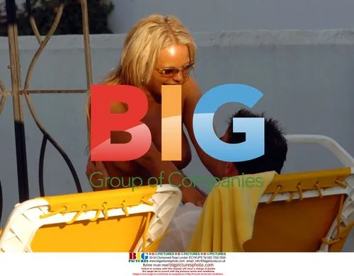 Glamour Girl Holly McGuire strips on Spanish holiday