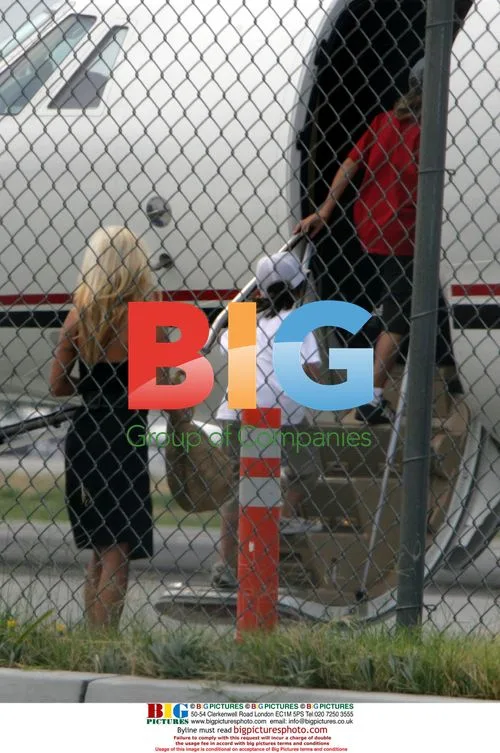 Pamela Anderson and sons at private jet