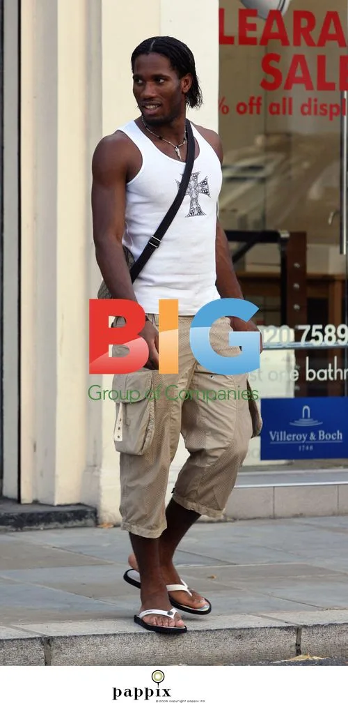 Chelsea footballer Didier Drogba in London with friend