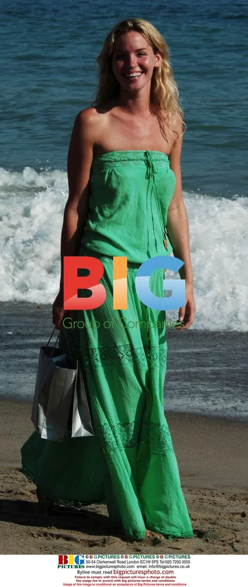 Actress Ashley Scott walks on Malibu beach