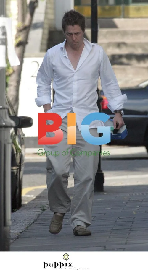 Hugh Grant Arrives Home with NHS Prescription