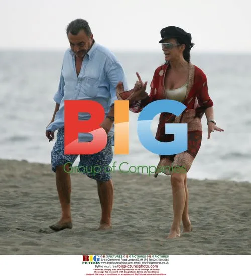 Nancy Dell'Olio and friend on beach in Italy