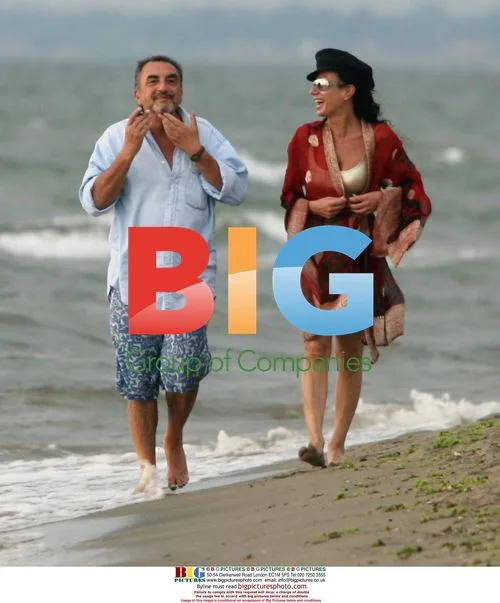 Nancy Dell'Olio and friend on beach in Italy