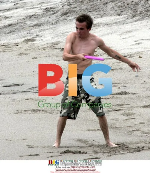 Frankie Muniz at the beach with girlfriend