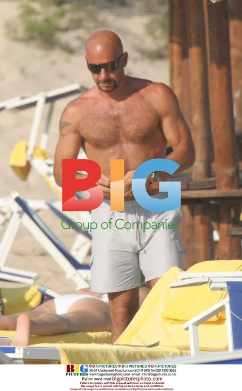 Footballer Gianluca Vialli relaxes on beach