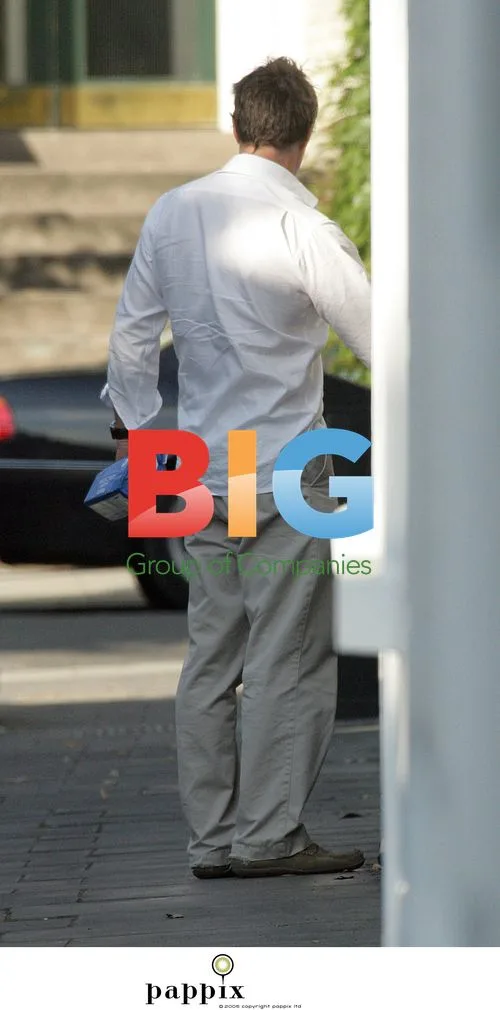 Hugh Grant Arrives Home with NHS Prescription Bag