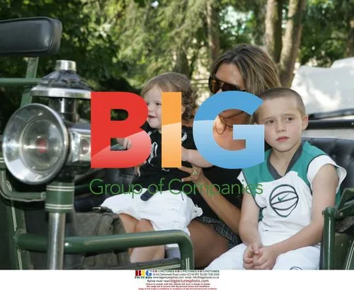 Victoria Beckham and sons in carriage