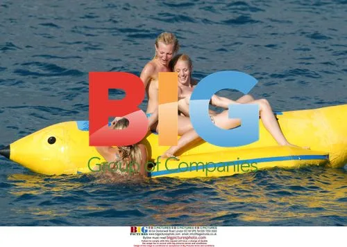 Glamour girls fool around on inflatable banana