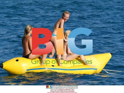 Glamour girls on inflatable banana