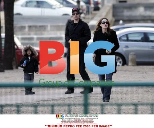 Brad Pitt, Angelina Jolie, and Maddox play with radio control cars