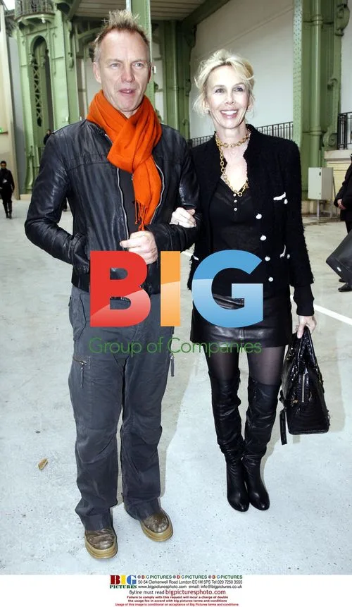 Singer STING and wife TRUDIE STYLER at Yves Saint-Laurent