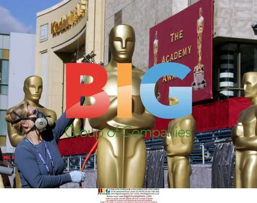 Workers paint Oscar statues for 78th Oscars