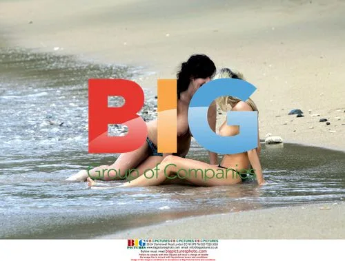 Sophie Howard and Charlotte cool off on beach