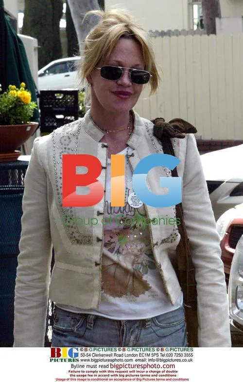 Melanie Griffith Displays AA 30-Day Badge