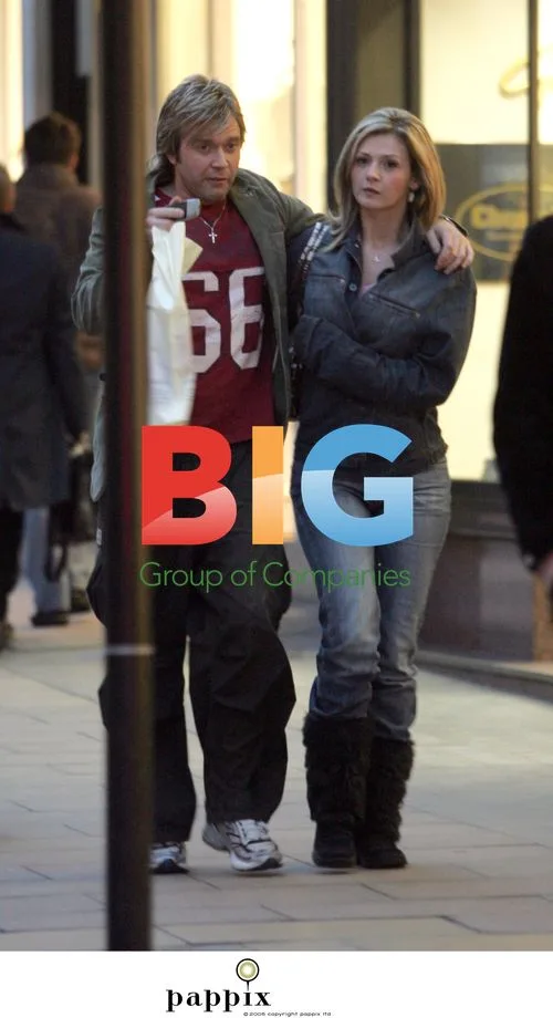 Darren Day looks bored on outing with girlfriend Stephanie Dooley