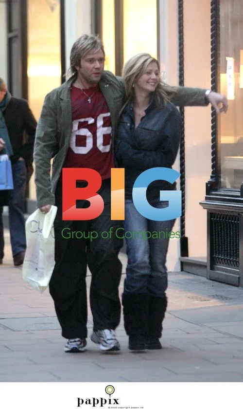 Darren Day looks bored with girlfriend in London
