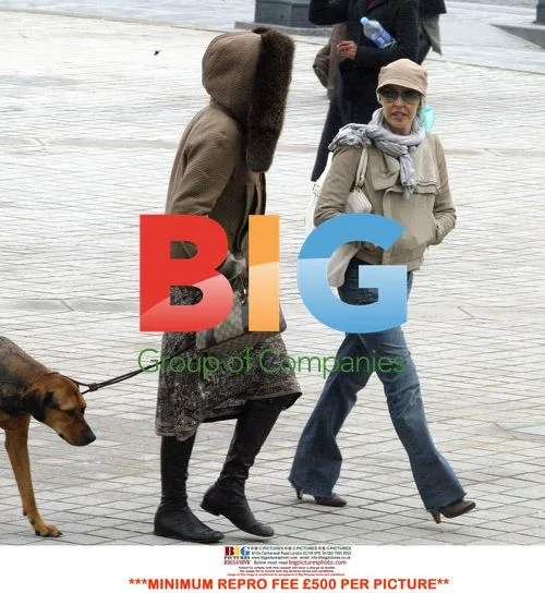 Kylie Minogue strolls in Paris with friend and dog