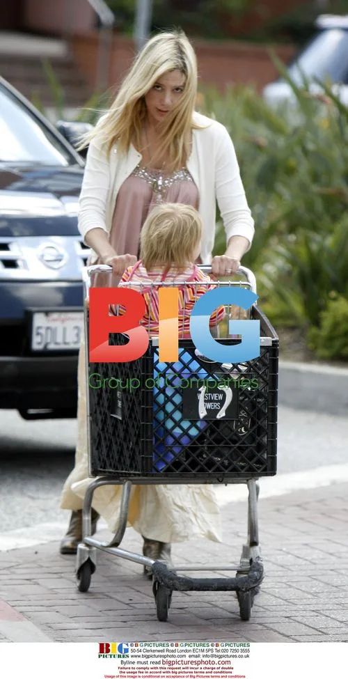 Mira Sorvino Juggles Phone, Drink While Pushing Daughter