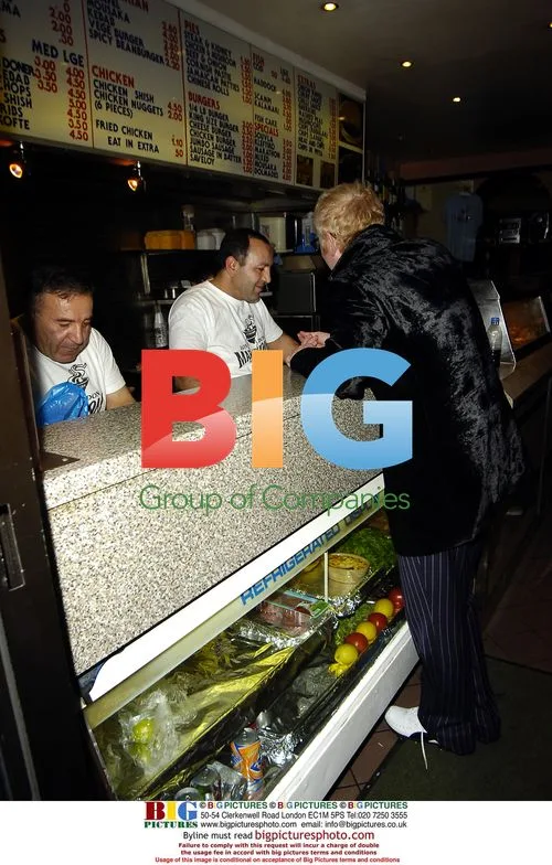Chris Evans visits chip shop with a friend