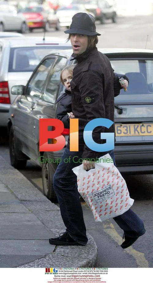 Liam Gallagher carries son Gene