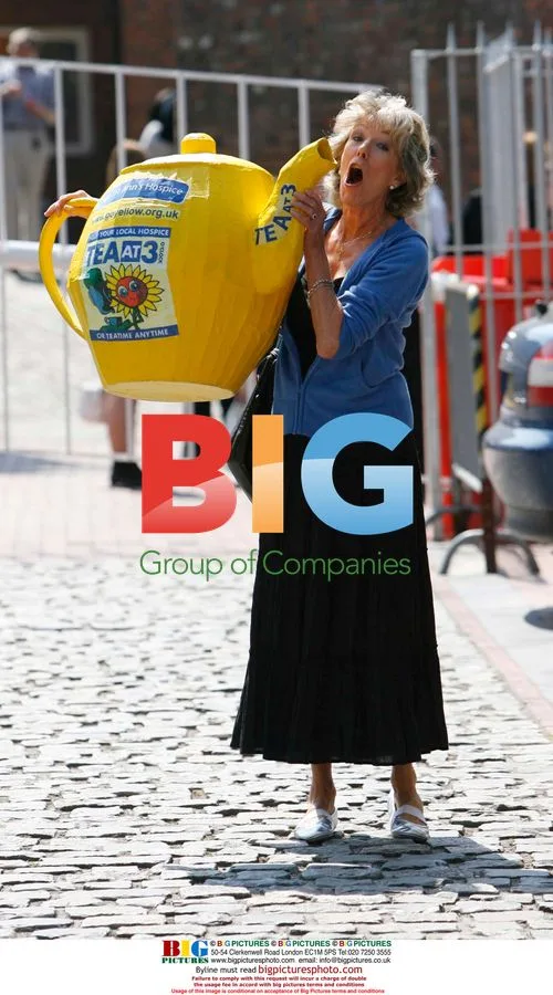 Sue Nicholls with giant yellow teapot