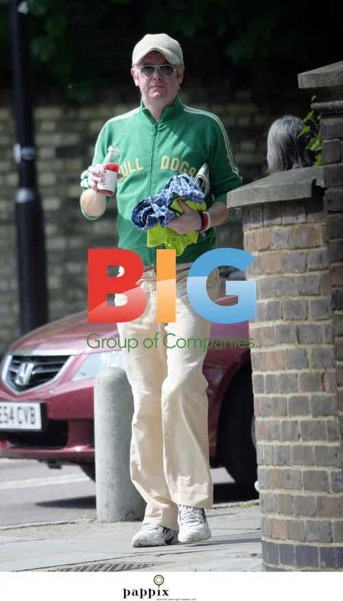 Chris Evans gulps down drink in London