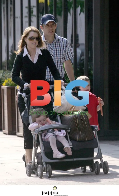 Everton's Phil Neville and family on shopping trip