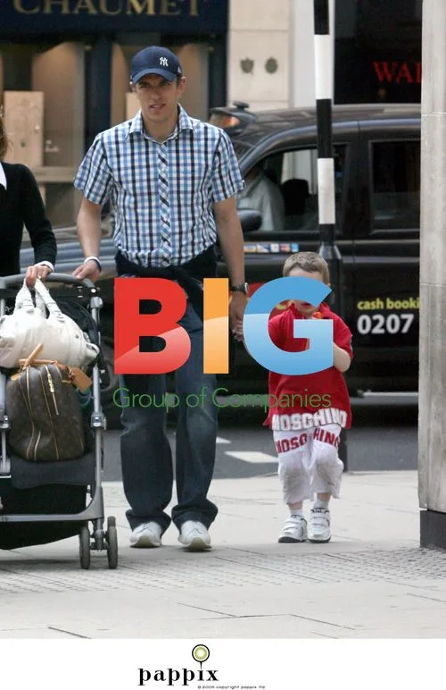 Phil Neville and family out shopping in London