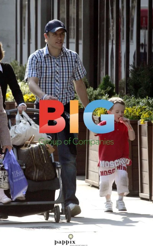 Phil Neville and Family Out Shopping in London