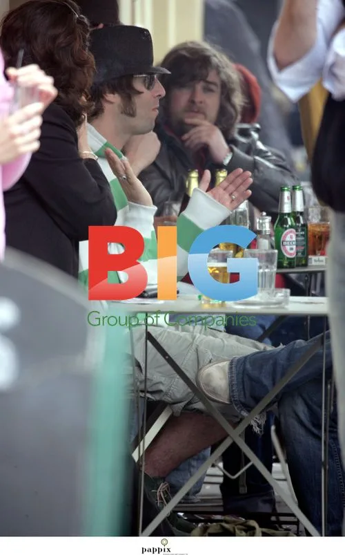 Liam Gallagher and brother Paul drinking in London pub