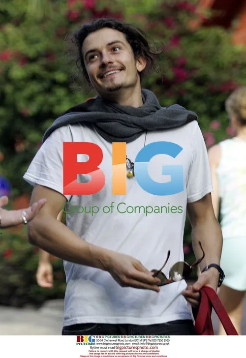 Orlando Bloom walks dog with friend