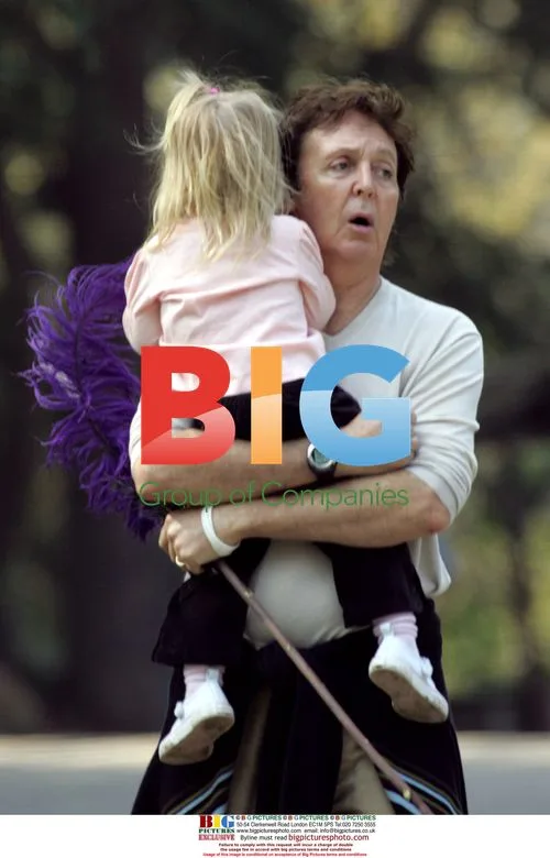 Paul McCartney with daughter Beatrice in park