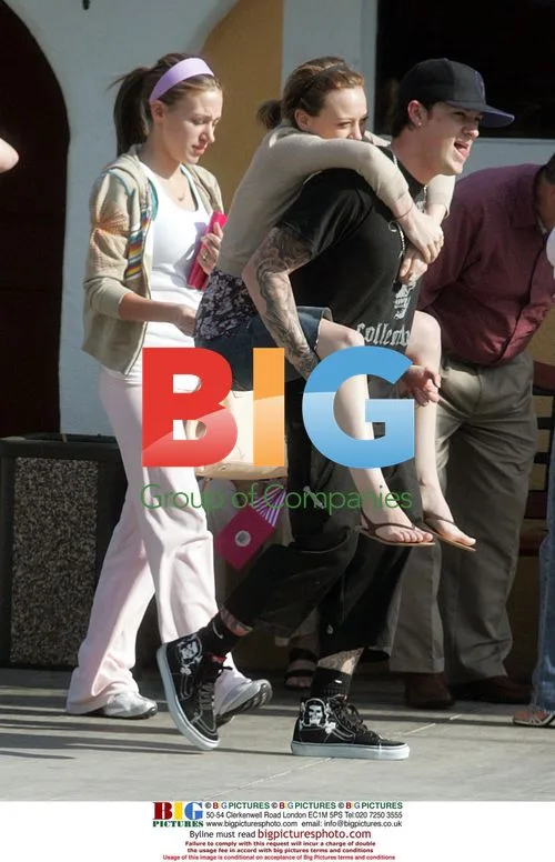Joel Madden gives Hilary Duff a piggyback ride