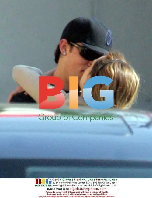 Joel Madden gives Hilary Duff a piggyback ride