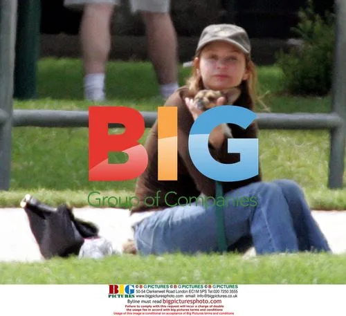 Calista Flockhart with son Liam and family dog in park