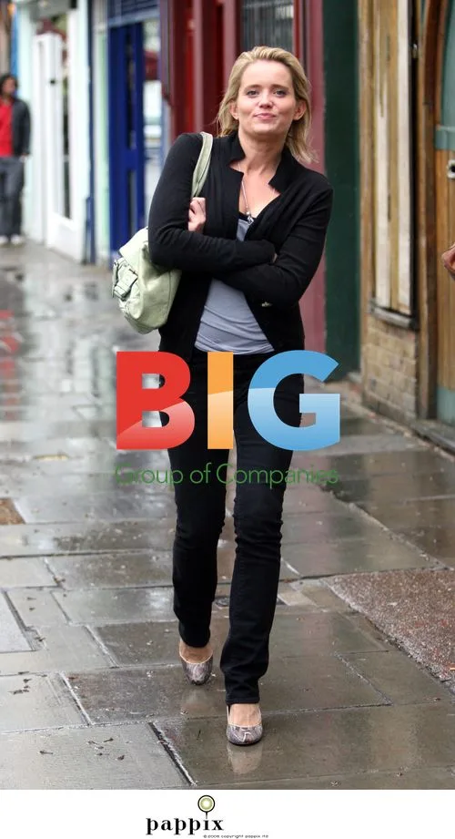 Danielle Brent takes walk in London rain