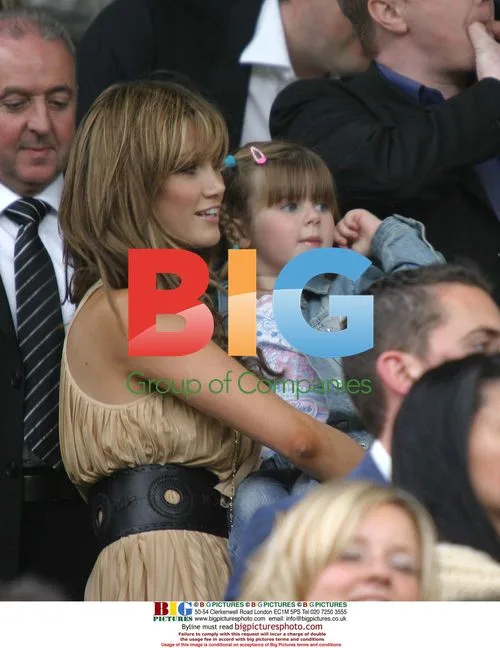Bryan McFadden, girlfriend Delta Goodrem and daughter at soccer match