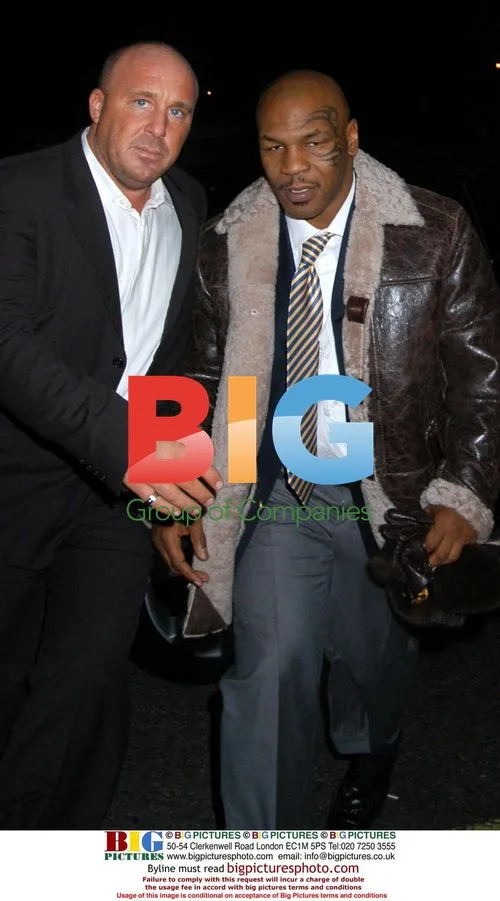 Mike Tyson and Aisleyne Hogan Wallace leave club