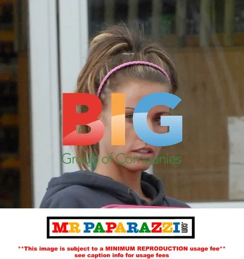 Katie Price Carrying Pink Box