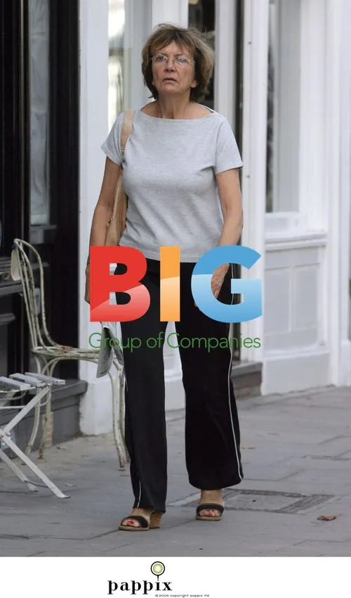 Joan Bakewell buys newspaper in London