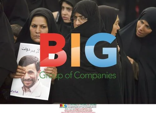 Iranian Woman Holds Photo of President Ahmadinejad